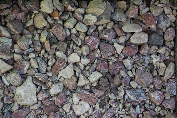 Crushed stone and multi-colored stones close-up element for the designer. Background like texture..