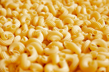 Italian pasta laid out on a white background. Background from pasta, isolate. Concept - food stocks during the covid-19 epidemic