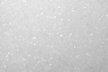 white snowflakes background, rough pattern of snow texture
