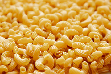 Italian pasta laid out on a white background. Background from pasta, isolate. Concept - food stocks during the covid-19 epidemic