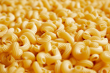 Italian pasta laid out on a white background. Background from pasta, isolate. Concept - food stocks during the covid-19 epidemic