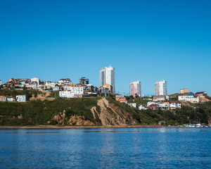Marine City Peyzad. City over the sea on a clear sunny day in the late warm autumn.