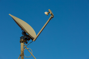 Satellite Dish with Clear Blue Sky in the Background