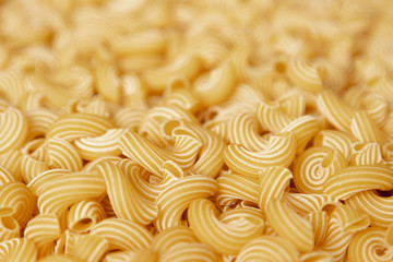 Italian pasta laid out on a white background. Background from pasta, isolate. Concept - food stocks during the covid-19 epidemic