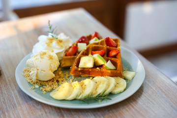 Waffle of fresh berries  strawberry, blueberry, bananas and chocolate topping,Sweet dessert cafe