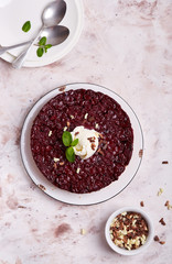 Upside down biscuit cake with cherries, served with vanilla ice cream and chocolate chips. Delicious homemade dessert