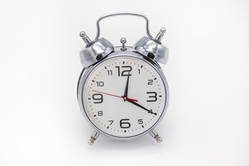 Analog alarm clock metallic color, isolated.
