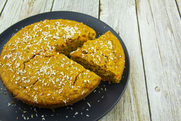 Slice of pie with carrots and coconut shavings