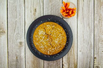 Slice of pie with carrots and coconut shavings