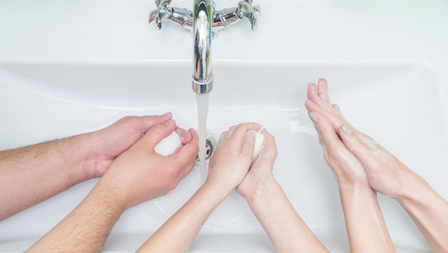 Family washing hands with soap. Pandemic coronavirus hand hygiene, covid-19 concept.