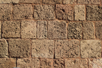 Sandstone wall texture. Limestone bricks that create building facade.
