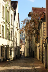 Picturesque view of a narrow street somewhere in Old Town of Riga. Empty center of Riga city.