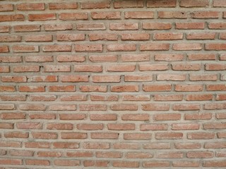 Red brick block wall show Pattern stack block rough surface texture material background Weld the joints with cement grout red color paint