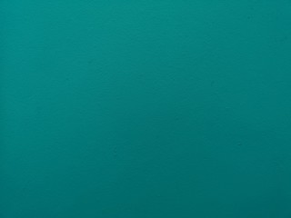 surface of the cement wall is rough, paint light curquoise color in texture material concrete background