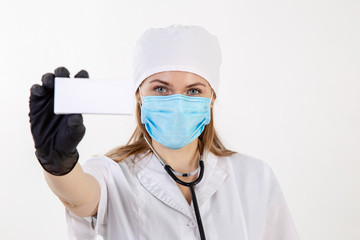 Doctor in a white coat holds a box.