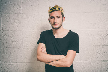 Portrait of a Man with a crown on his head folded his arms