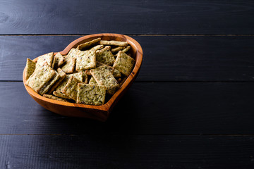 healthy bread rolls with celery and flax seeds in a heart plate
