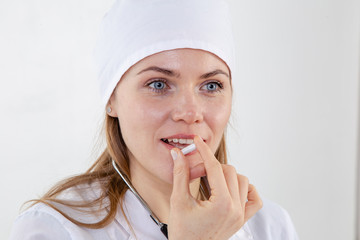 The doctor is taking the medicine.