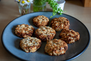 Beautiful plate of easy to prepare and healthy, home made outmeal cookies – made by a little girl