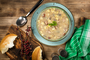 Traditional polish soup Zurek in ceramic bowl.