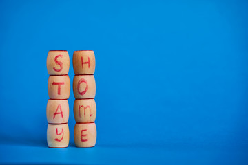 Stay Home, words and mercury thermometer on blue background