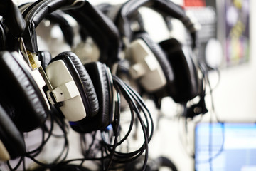 Headphones hanging in a music studio