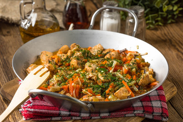 Fried chicken pieces with vegetables.