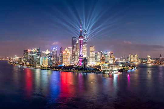 Pudong skyline with lightshow at night, Shanghai, China