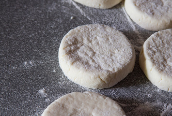 The process of cooking delicious fried cheesecakes closeup on the table. Traditional in Ukraine, Belarus and Russia. The concept of healthy homecooked food