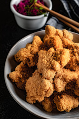 Delicious crispy fried chicken breast strips.