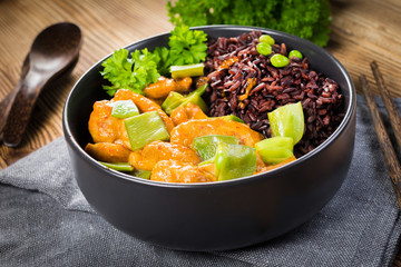 Thai red curry with chicken and black rice.
