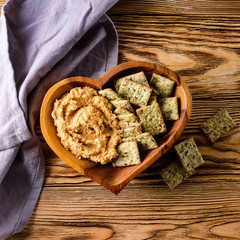 healthy bread and hummus in a plate heart rustic still