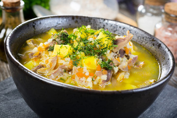 Polish barley soup with vegetables and chicken heart.