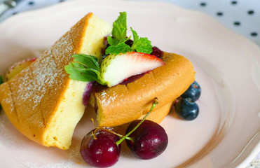 The bread was turned into triangles, stacked in layers, sprinkled with powdered sugar, decorated with cherries and mint leaves.