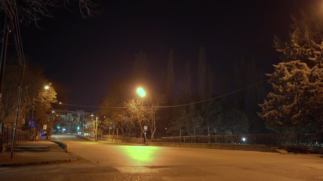 Simferopol empty city streets with street lights at night in autumn.