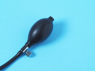 Black pear tonometer closeup on blue background