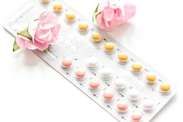 concept of female contraception on white background