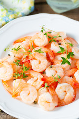 boiled shrimps on wooden surface