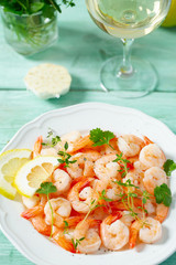 boiled shrimps on wooden surface