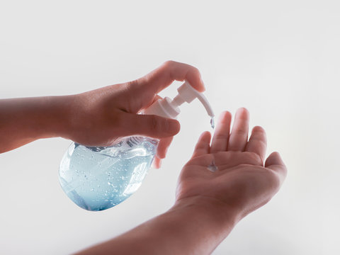 hands using wash hand sanitizer gel pump dispenser for anti virus bacteria dirty skin care on white background