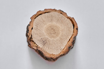 round wooden structure on a white background