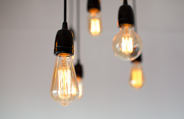 Decoration antique edison led light style filament light bulbs , graphic of wire background and copyspace on top,color vintage style. Warm.