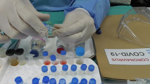 Scientist Investigates Medical Treatment for Covid-19 Coronavirus in Hospital, Spain