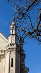 Fototapeta na wymiar Church tower in the city of Paris