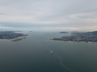 Aerial view cruise move towards Penang. Background is Penang Bridge.