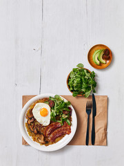 Potato rosti with mashrooms, egg, bacon and green salad