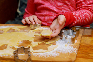 Hands close up beautiful girl in makes doing bakery,