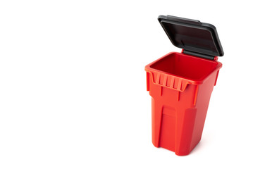 red plastic bin on white background with copy space on left - Powered by Adobe