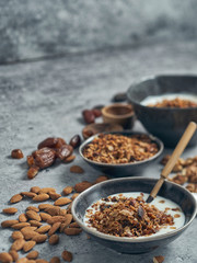 Home made granola with flaked almonds, served with yogurt