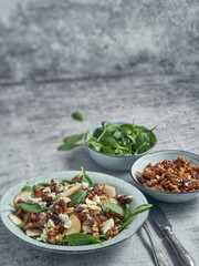 Pear and spinach salad with walnuts and blue cheese